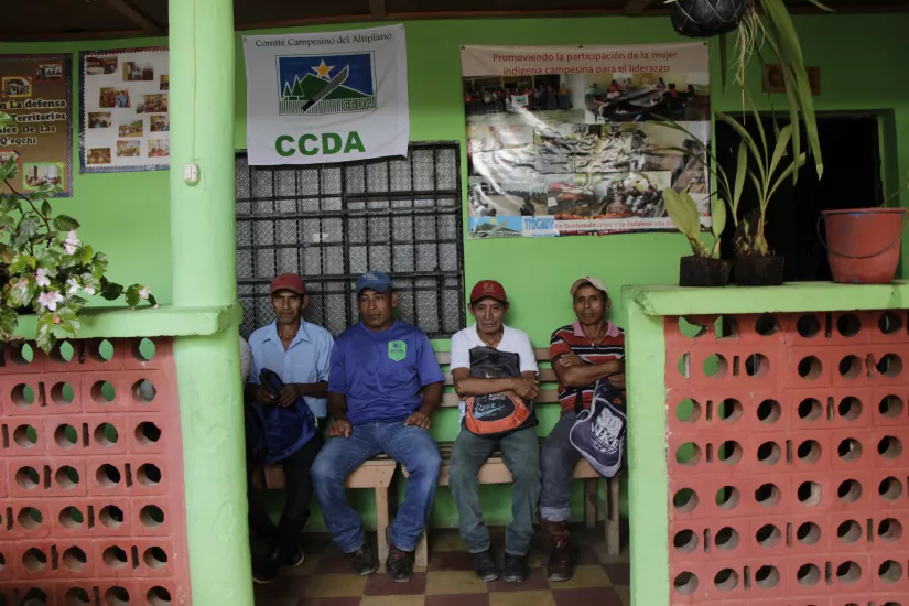 Men sit in front of office of accompanied defender Coban Guatemala