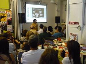 Alma speaks to an audience during her European tour